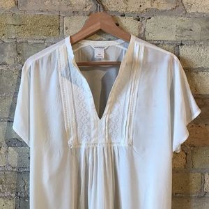 Woven pin tuck blouse with embroidery.